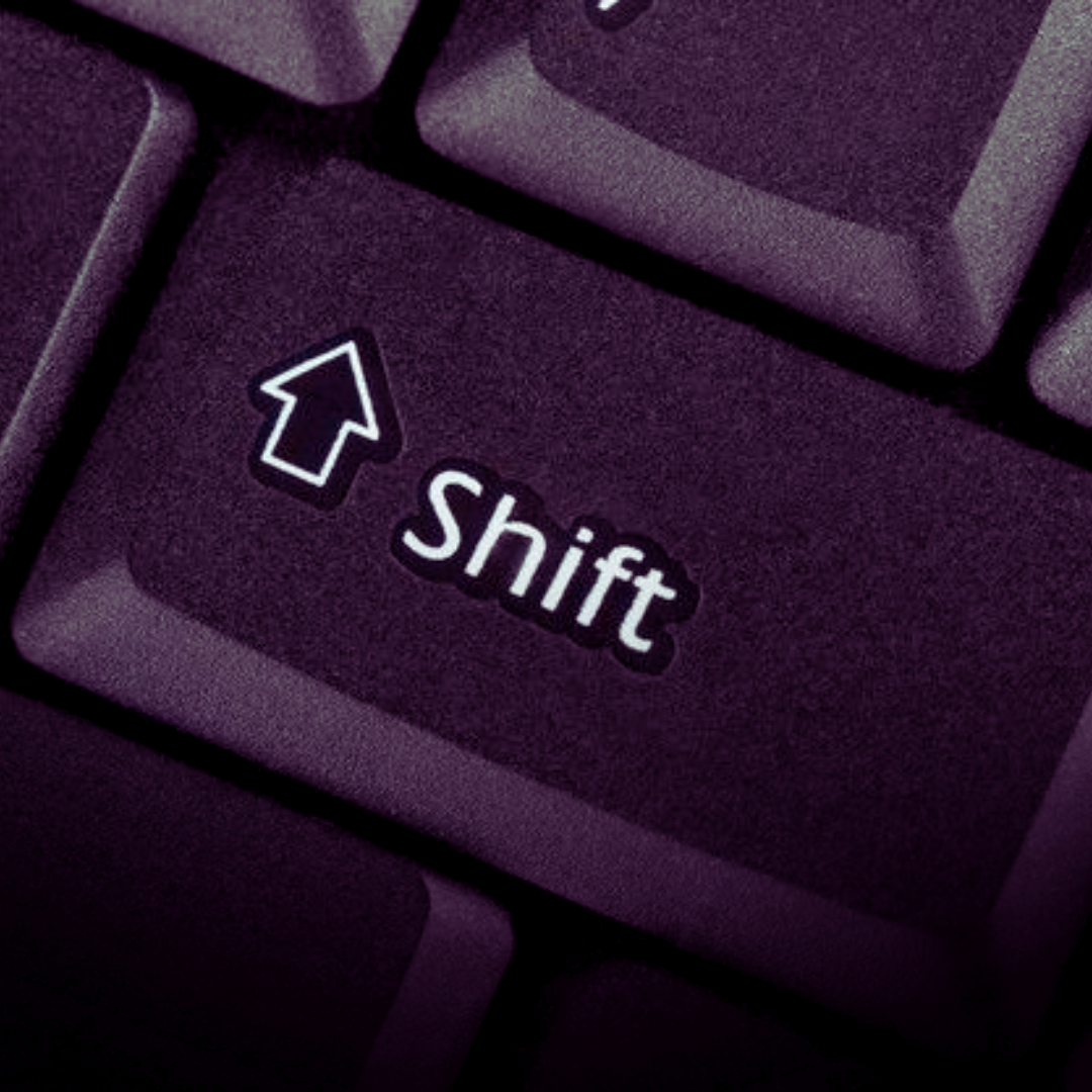 Close-up of a keyboard Shift key symbolizing evolution, innovation, and the changing landscape of the creative economy.